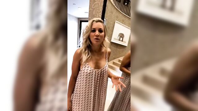 Kaley Cuoco checking herself in a mirror