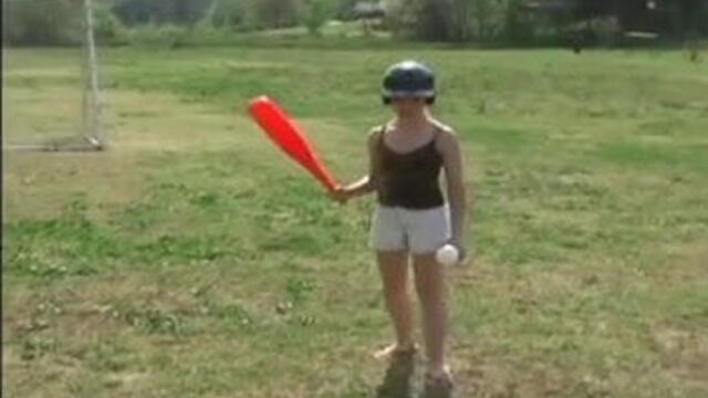 Innocent teen Kitty playing softball outdoors