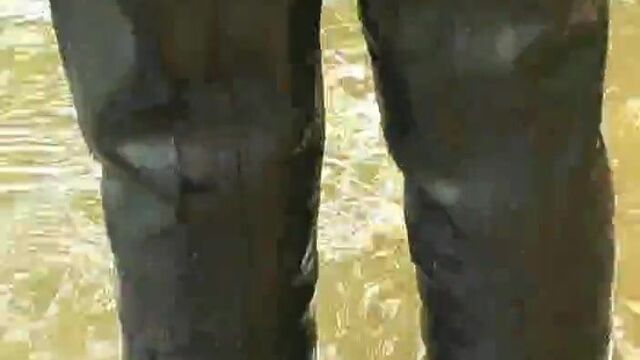 Girl in wetsuit and rubber raniwear fetish soft