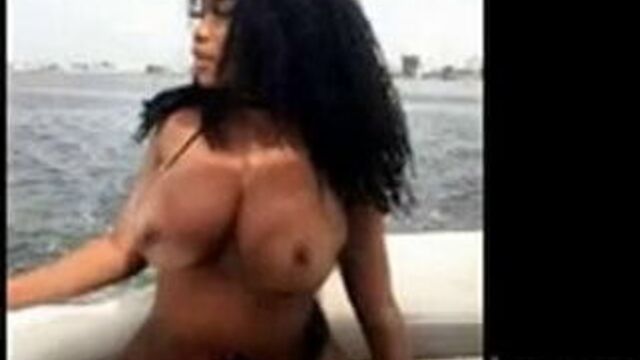 Ada La Pinky strips in seaboat and removes bra showing boobs