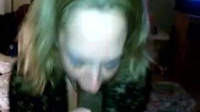 White MILF sucking a hung black cock