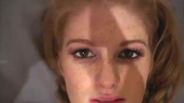 Beautiful redhead with a strap-on